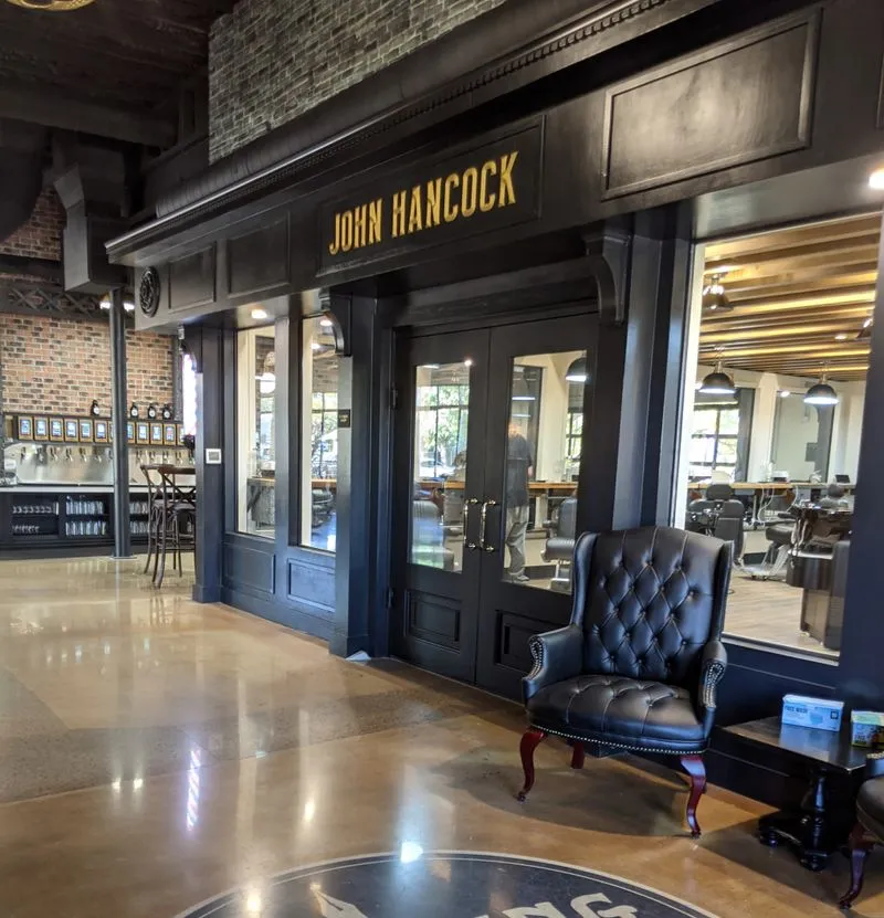 John Hancock Barbershop Front entrance of John Hancock Barber shop inside Founding Fathers Collective in Prescott