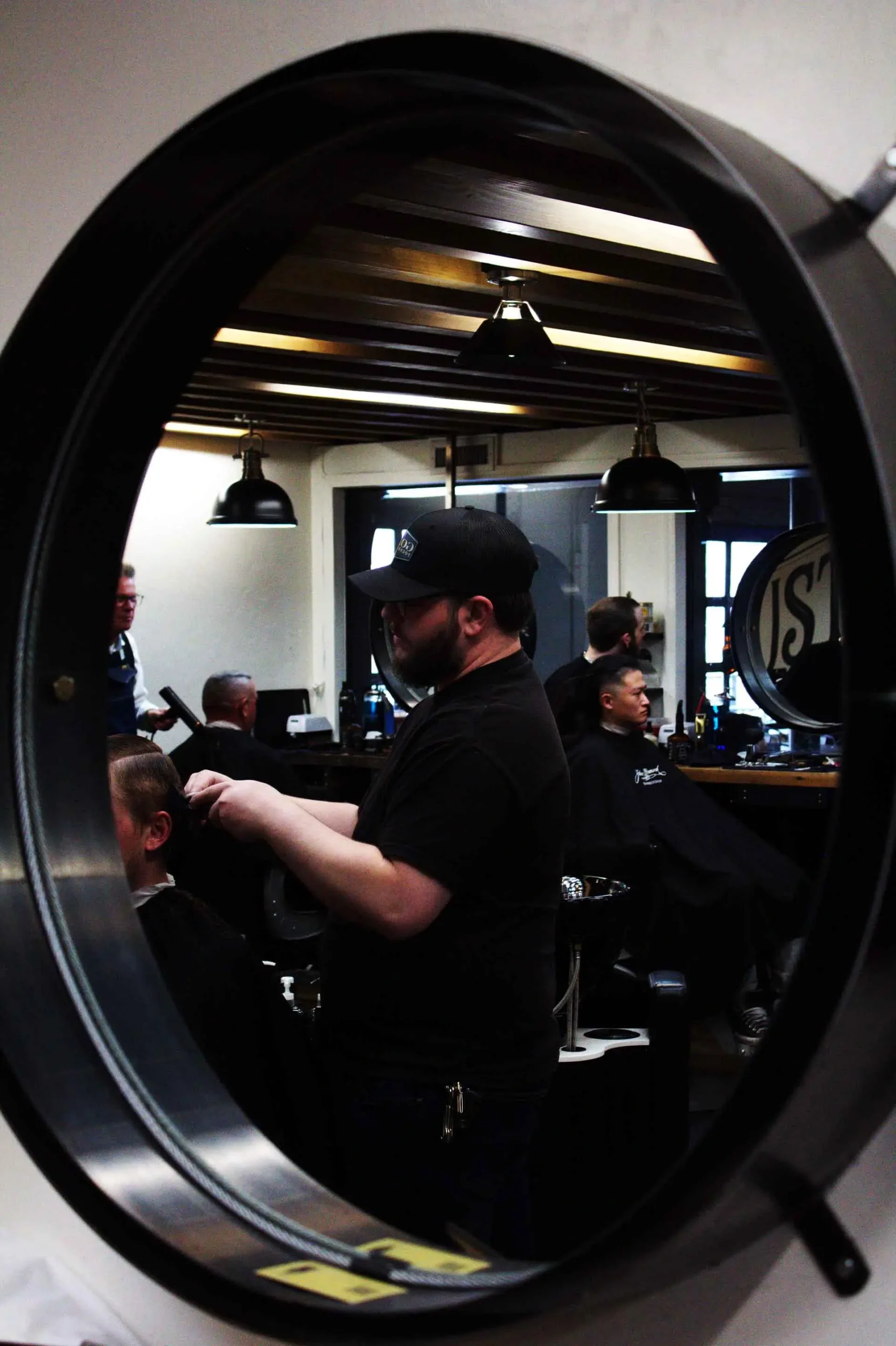 Founding fathers collective of John Hancock barber doing haircut